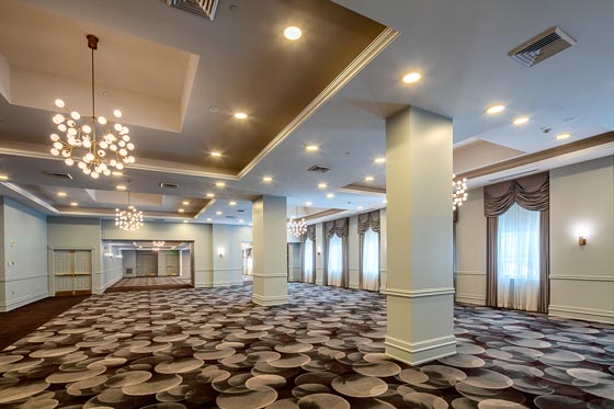 Beautifully decorated wedding ceremony setup at the Genesee Grande Ballroom, Collegian Hotel & Suites Syracuse